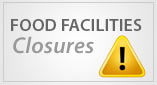 Food Facilities Closures warning sign with an attention triangle symbol